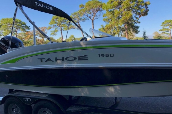 a boat sitting on top of a car