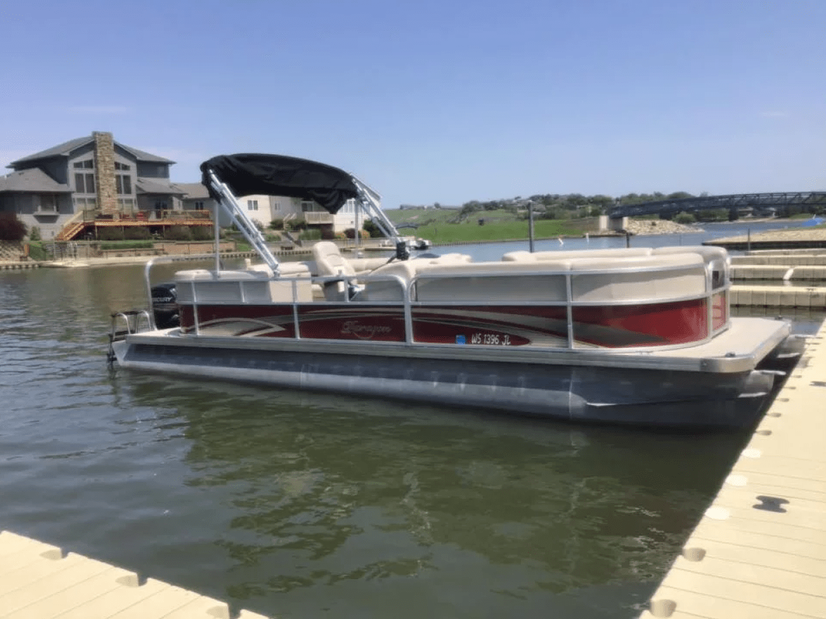 a boat is docked next to a body of water