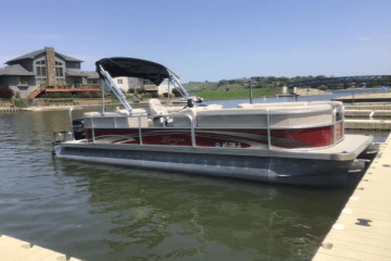 a boat is docked next to a body of water