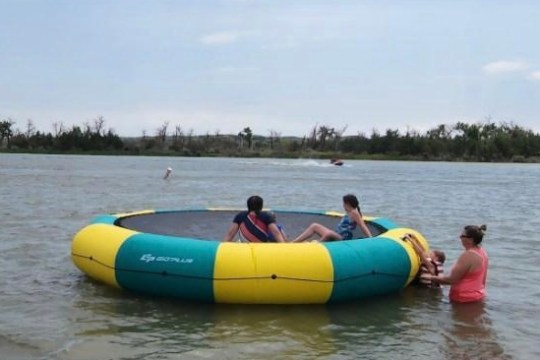 a group of people on a raft in a body of water